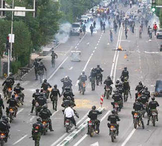 Iranian security personnel gather during a march on a street in Tehran