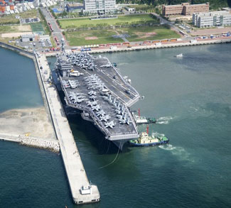 The USS George Washington aircraft carrier moors in Busan