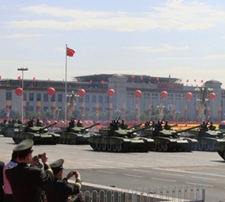 File photo of tanks rumbling pass Tiananmen Square in a parade to mark the 60th anniversary of the founding of the People's Republic of China in Beijing