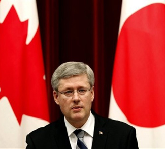 Harper Between Canadian And Japanese Flag