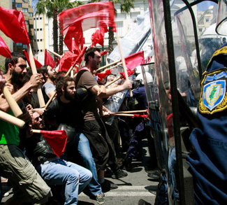 Protesters clash with policemen during riots at a May Day rally in Athens, cc Flickr Joanna