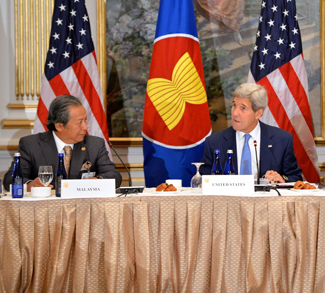 Flanked by Malaysian Foreign Minister Anifah Aman and Assistant Secretary of State for East Asian and Pacific Affairs Daniel Russel, U.S. Secretary of State John Kerry participates in the U.S.-ASEAN meeting on the sidelines of the 70th Regular Session of the UN General Assembly in New York, New York, on September 30, 2015. [State Department photo/ Public Domain]