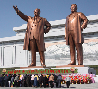 kimstatues, J.A. de Roo, Wiki Commons, https://commons.wikimedia.org/wiki/File:The_statues_of_Kim_Il_Sung_and_Kim_Jong_Il_on_Mansu_Hill_in_Pyongyang_(april_2012).jpg