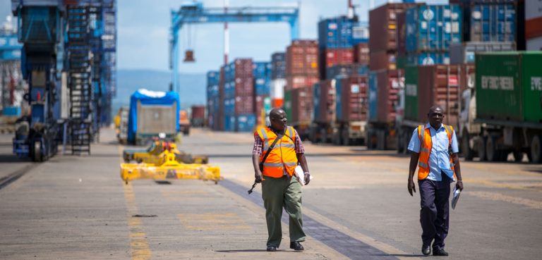 KENYA, Mombasa: Photograph taken by the Kenyan Ministry of East African Affairs, Commerce and Tourism (MEAACT) 31 July shows officials walking inside Mombasa Port on Kenya's Indian Ocean coast. MANDATORY CREDIT: MEAACT PHOTO / STUART PRICE. , modified