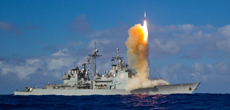 Aegis missile launch, cc Flickr U.S. Missile Defense Agency, modified, https://creativecommons.org/licenses/by/2.0/. May 16, 2013 - A Standard Missile – 3 (SM-3) Block 1B interceptor is launched from the USS LAKE ERIE (CG 70) during a Missile Defense Agency and U.S. Navy test in the mid-Pacific. The SM-3 Block 1B successfully intercepted a target missile that had been launched from the Pacific Missile Range Facility, Barking Sands, Kauai, Hawaii. Following target launch, the LAKE ERIE detected and tracked the target with its onboard AN/SPY-1 radar. The ship, equipped with the second-generation Aegis BMD weapon system, developed a fire control solution and launched the SM-3 Block 1B. The intercept occurred a few minutes later. Today’s event was the third consecutive successful intercept test of the SM-3 Block IB missile. To learn more, visit www.mda.mil/system/aegis_bmd.html.