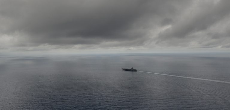 The USS Ronald Reagan transits the South China Sea, cc Flickr Official U.S. Navy Page, modified, https://creativecommons.org/licenses/by/2.0/ / SOUTH CHINA SEA (July 5, 2016) The Navy's only forward-deployed aircraft carrier USS Ronald Reagan (CVN 76) transits the South China Sea. Ronald Reagan, the Carrier Strike Group Five (CSG 5) flagship, is on patrol in the U.S. 7th Fleet area of responsibility supporting security and stability in the Indo-Asia-Pacific region. (U.S. Navy photo by Mass Communication Specialist 3rd Class Nathan Burke/Released) 160705-N-OI810-110