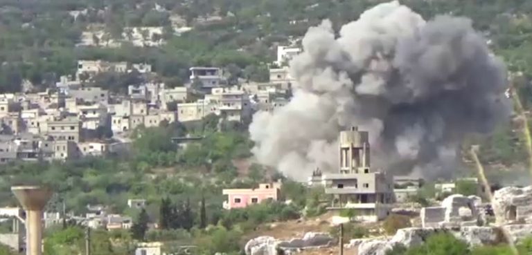 A strike in Bidama in Idlib in 2017; cc Qasioun News Agency, modified, https://en.wikipedia.org/wiki/Hama_offensive_(September_2017)#/media/File:Airstrike_in_Bidama,_west_of_Idlib.jpg